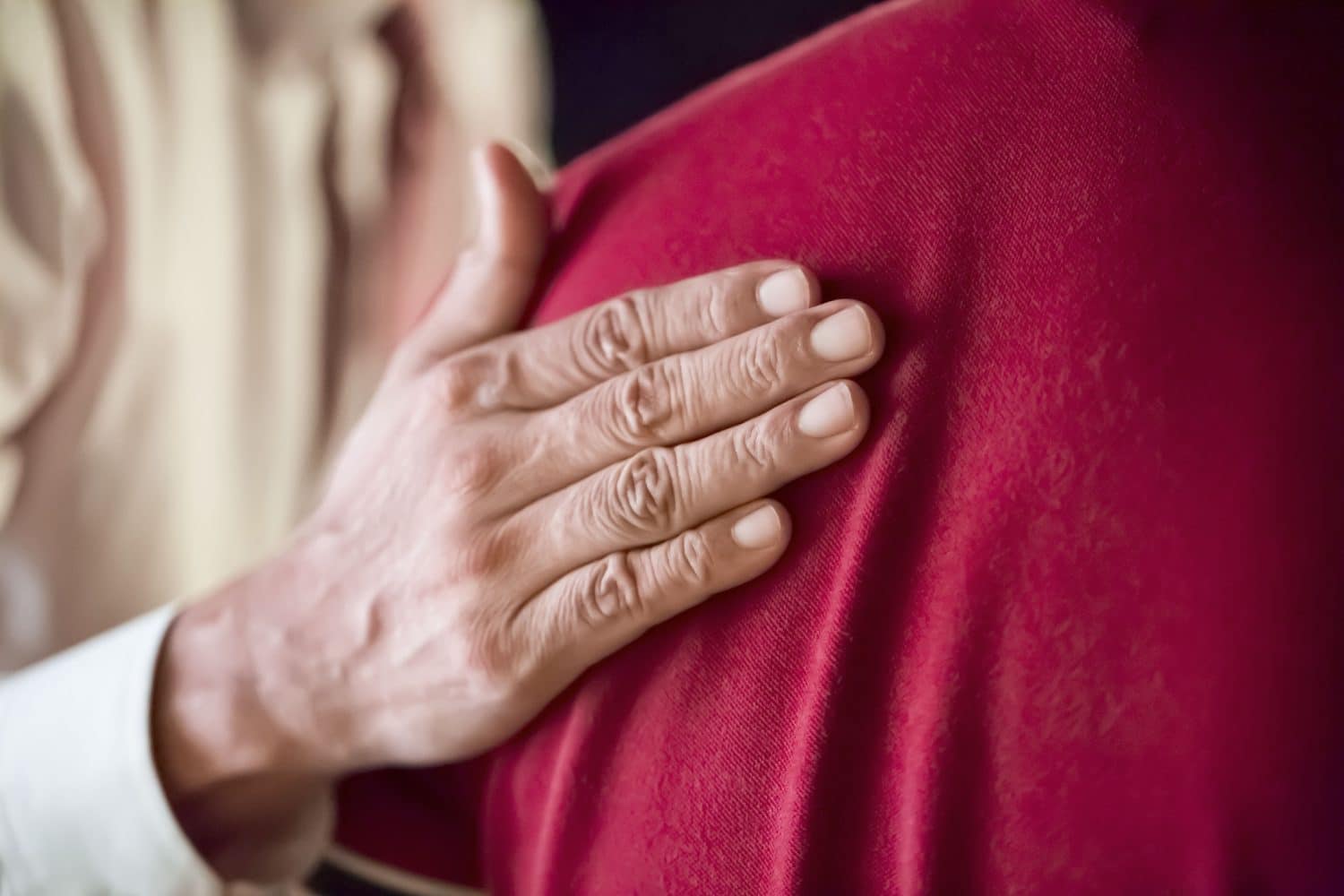 An experienced social security disability attorney comforts a client in Indianapolis.