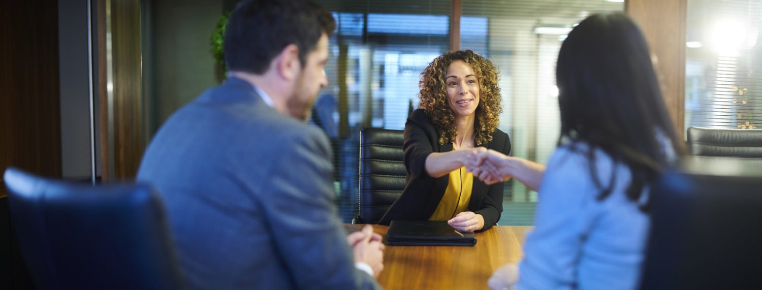 a woman hiring an Indianapolis workers’ comp lawyer after an injury