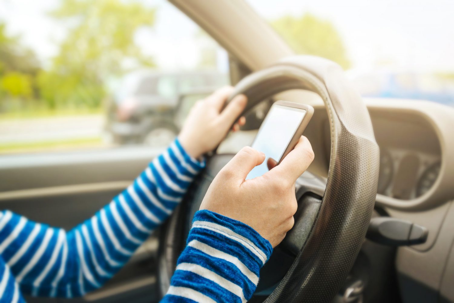 a distracted driver on the road