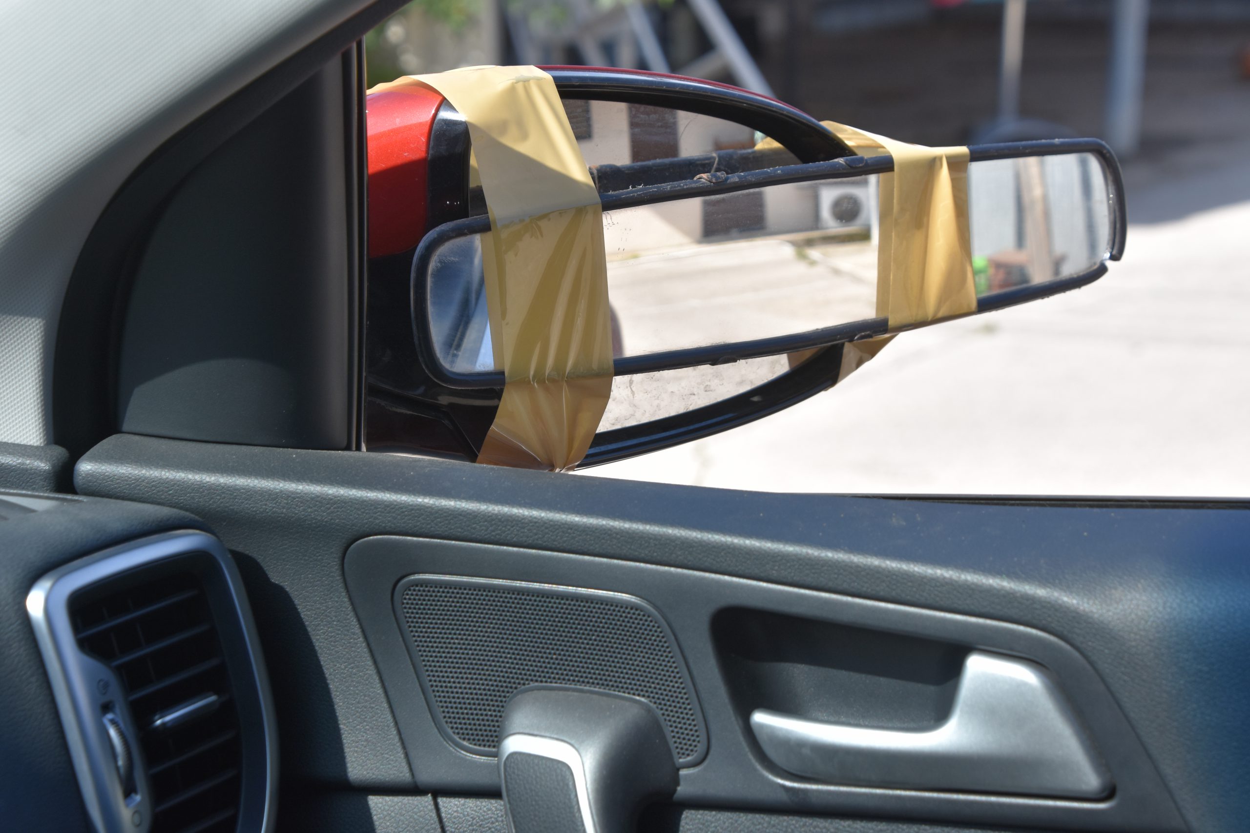 funny improvisation, a mirror paste on a side mirror of a vehicle
