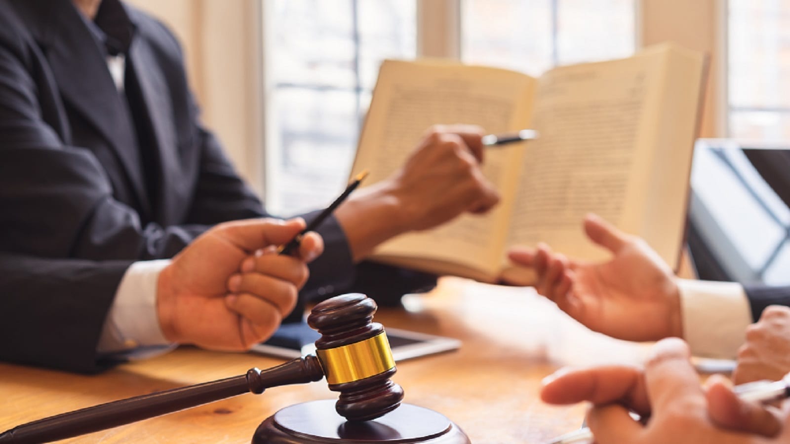 Attorneys Reading Law Book Stock Photo
