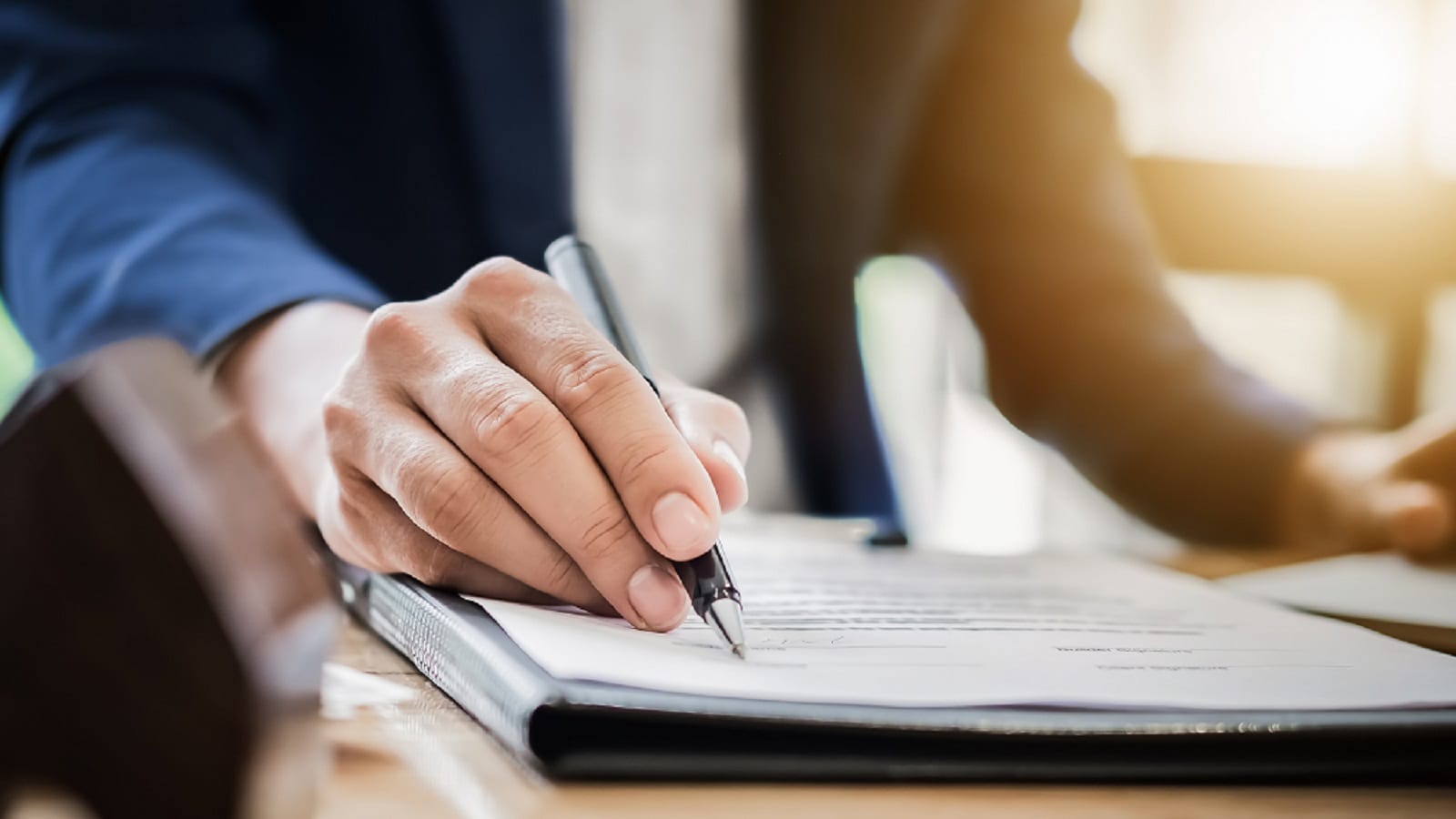 Attorney Signing Documents Stock Photo