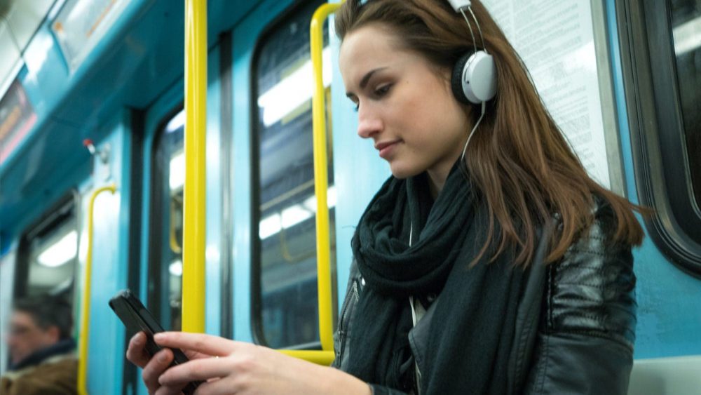 Young Woman Riding A City Bus Stock Photo