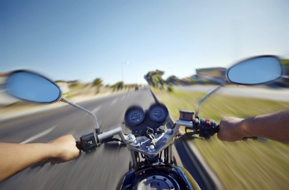 Motorcyclist Riding Motorcycle During The Day Stock Photo