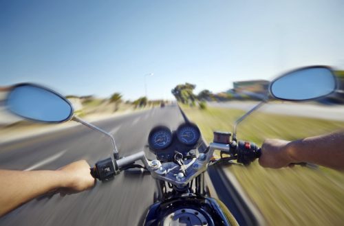 Motorcyclist Riding Motorcycle During The Day Stock Photo