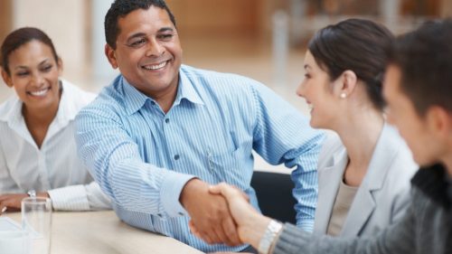Lawyer Shaking Hands With A Client Stock Photo