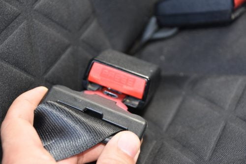 Woman Fastening Seat Belt Stock Photo