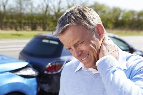 Male Driver Experiencing Neck Pain After A Rear End Car Accident