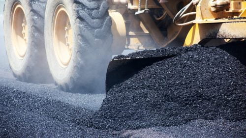 Dump Truck Working With Blacktop Stock Photo