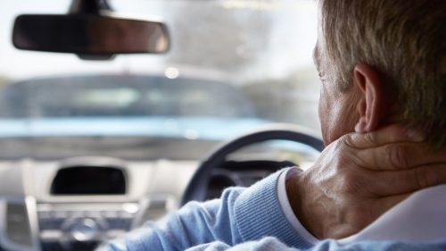 Elderly Man With A Whiplash Injury Stock Photo
