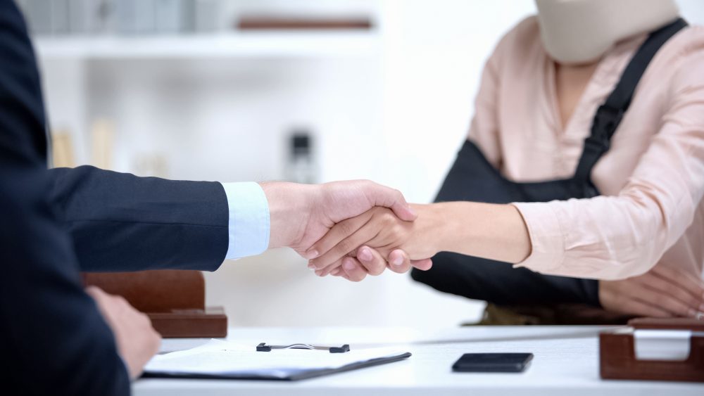 a woman hiring a lawyer after a car accident in Indianapolis