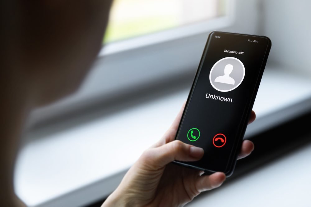 Phone showing an incoming call from a stranger