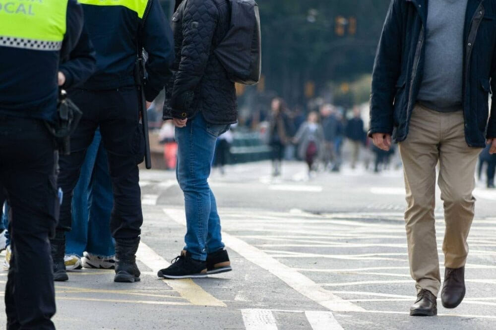 Low shot of pedestrians walking on a crosswalk
